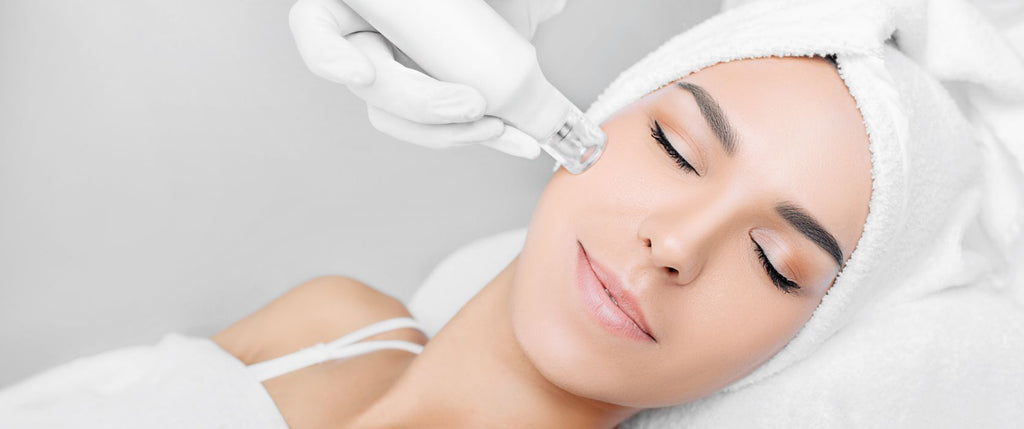 woman with smooth skin receiving mesotherapy microinjection to cheek