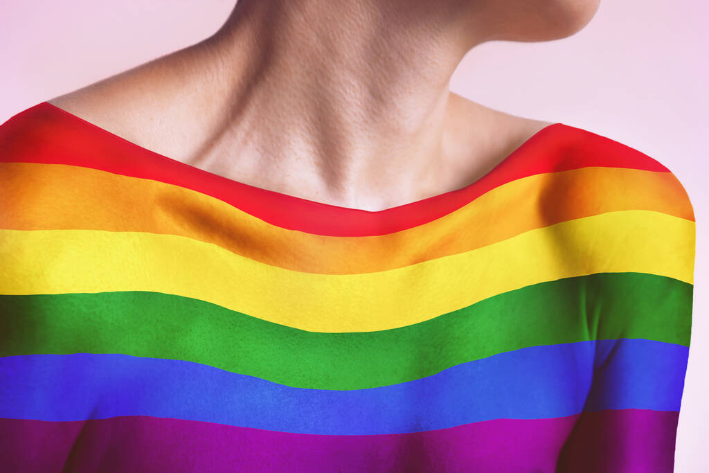 LGBTQ+ flag on female upper body